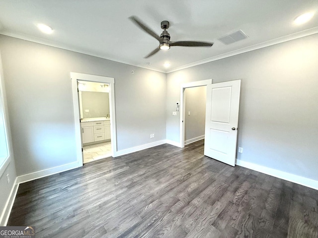 unfurnished bedroom featuring dark hardwood / wood-style floors, ceiling fan, ornamental molding, and connected bathroom