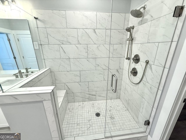 bathroom with a shower with door