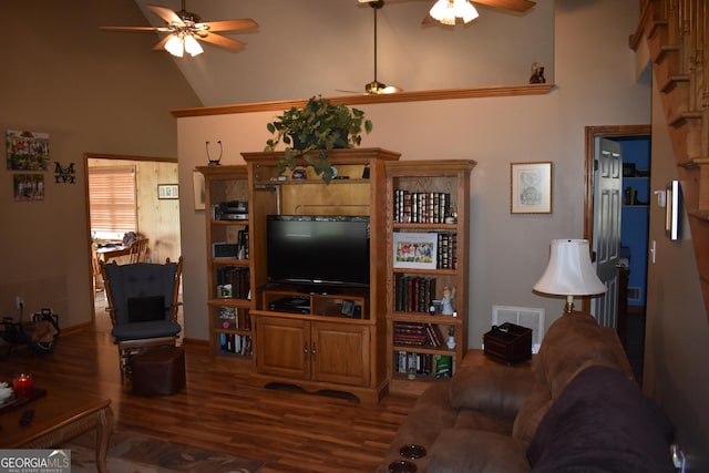 living room with ceiling fan, dark hardwood / wood-style flooring, and high vaulted ceiling