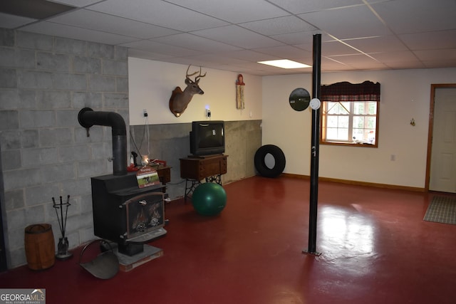 workout area featuring a wood stove