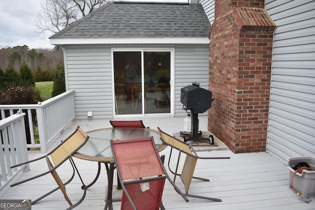 wooden terrace with area for grilling