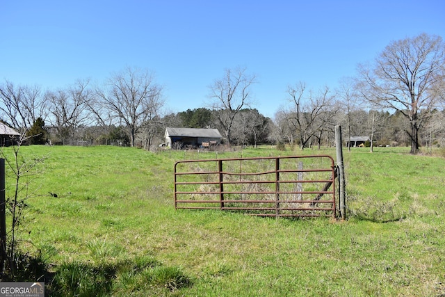 view of gate featuring a rural view