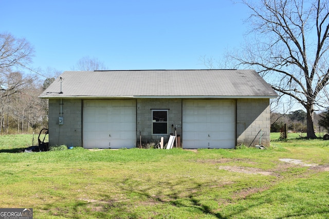 garage featuring a yard