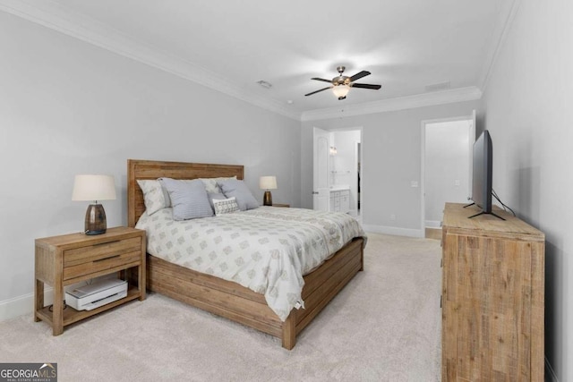 bedroom with crown molding, light colored carpet, ceiling fan, and ensuite bath