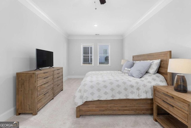 bedroom with ornamental molding, light colored carpet, and ceiling fan