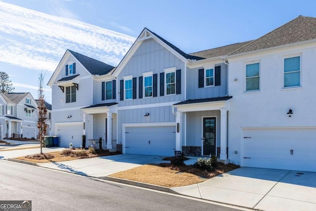 view of front of house with a garage and central air condition unit