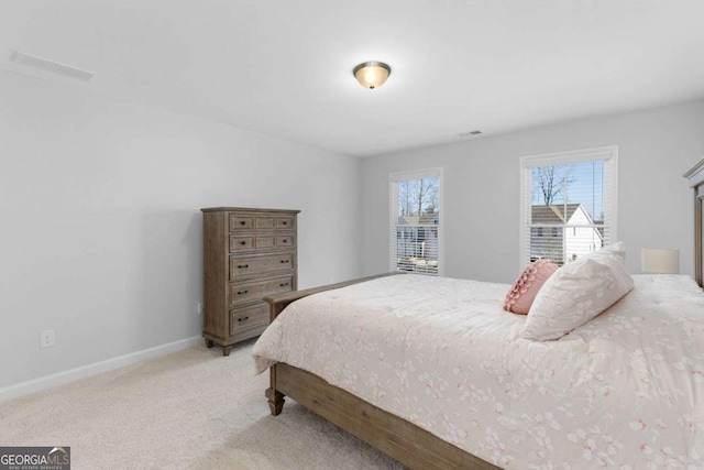 bedroom with light colored carpet