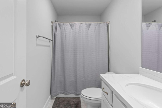 bathroom with vanity, a shower with curtain, tile patterned floors, and toilet