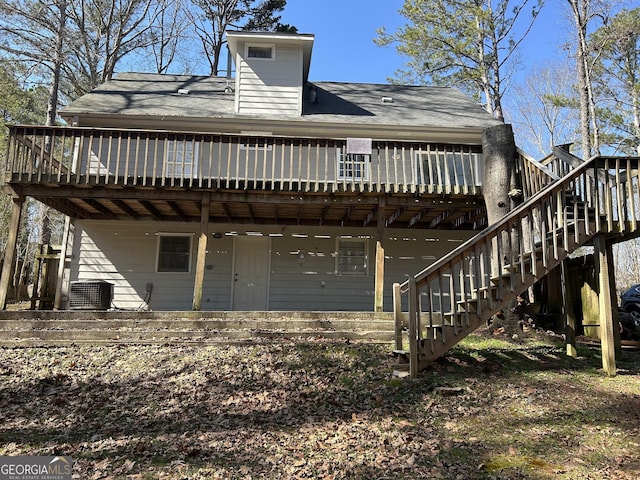 back of house featuring stairs, a deck, and cooling unit