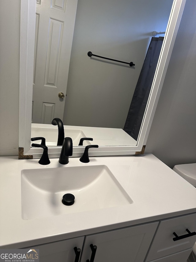 full bath with vanity and toilet