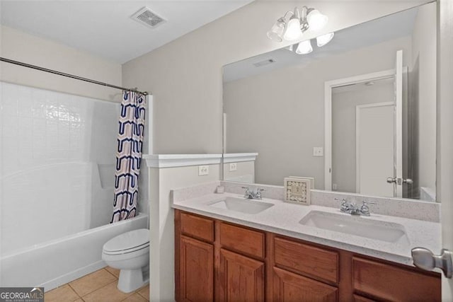 full bathroom with vanity, toilet, tile patterned flooring, and shower / bath combo with shower curtain