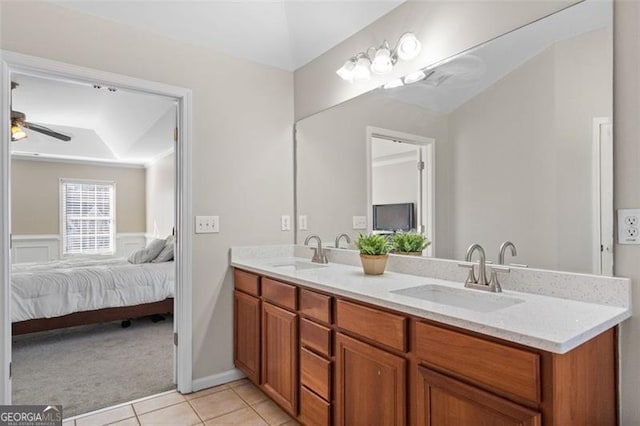 bathroom with ceiling fan, vanity, and tile patterned flooring