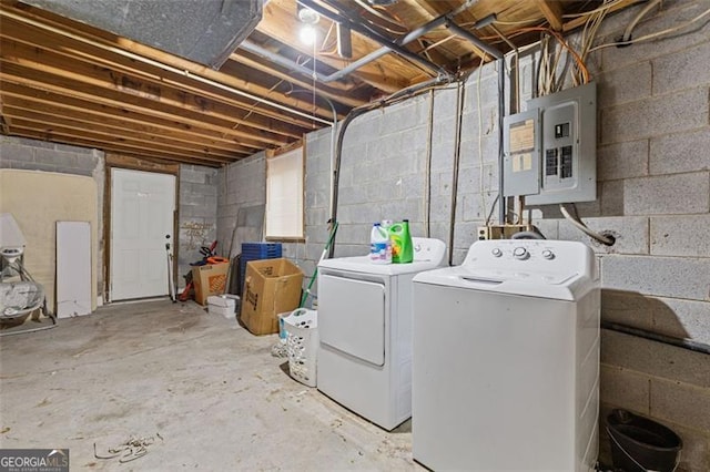 laundry room featuring electric panel and washer and dryer