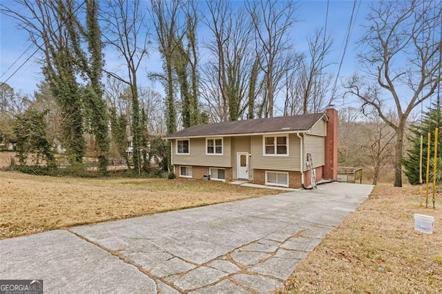 bi-level home with a front yard