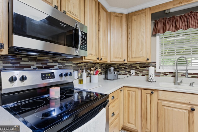 kitchen featuring light brown cabinetry, sink, backsplash, and appliances with stainless steel finishes