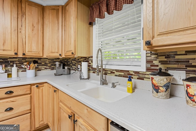 kitchen with sink, backsplash, and light brown cabinets