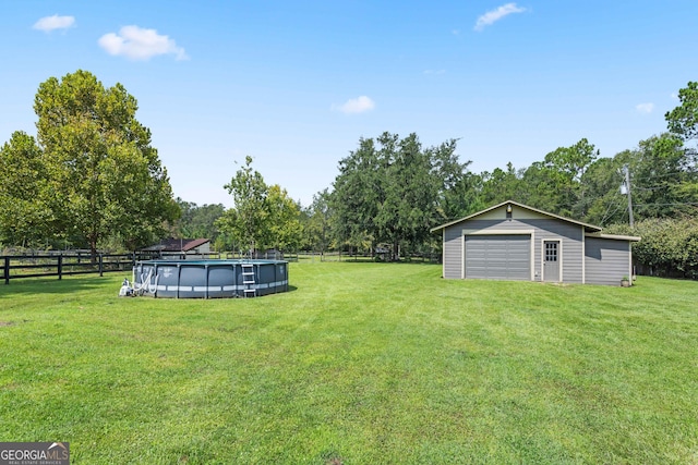 view of yard with a fenced in pool