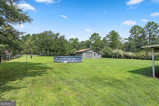 view of yard featuring a covered pool