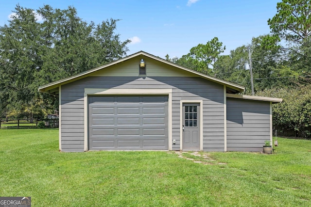 garage with a lawn