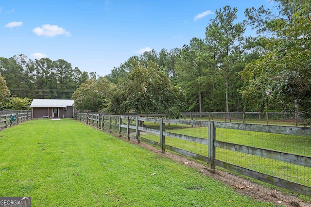 view of yard with a rural view