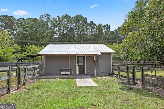 view of outdoor structure featuring a lawn