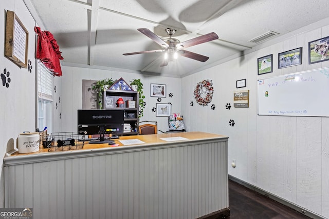 office with ceiling fan and wooden walls