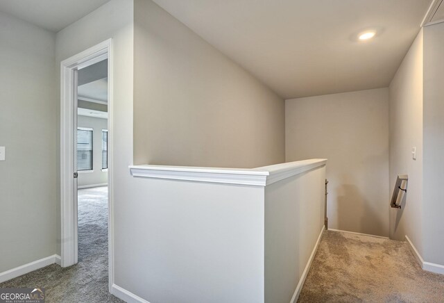 hallway featuring carpet flooring