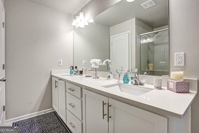 bathroom featuring walk in shower and vanity