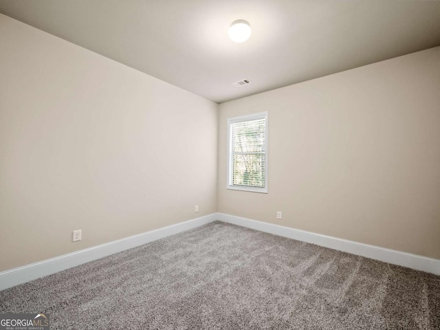 empty room featuring carpet flooring