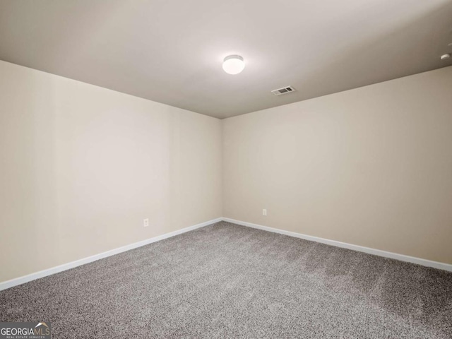 unfurnished room featuring carpet