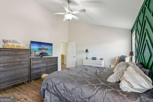 bedroom with ceiling fan and hardwood / wood-style floors