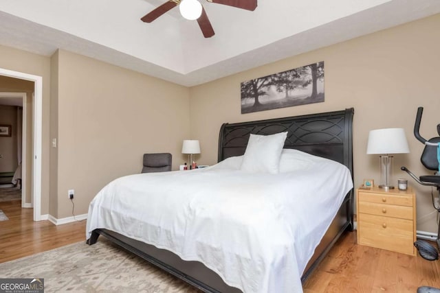 bedroom featuring light wood-type flooring and ceiling fan