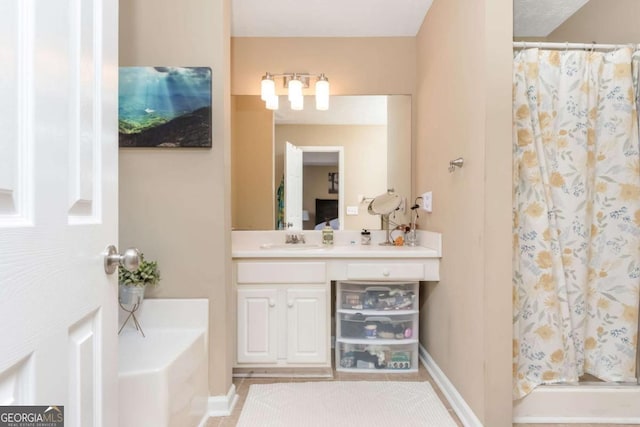 bathroom featuring tile patterned flooring, walk in shower, and vanity