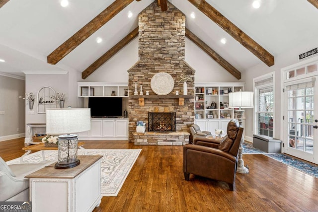 living room with high vaulted ceiling, beam ceiling, and a stone fireplace