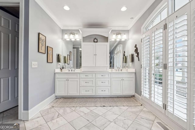 bathroom featuring vanity and crown molding