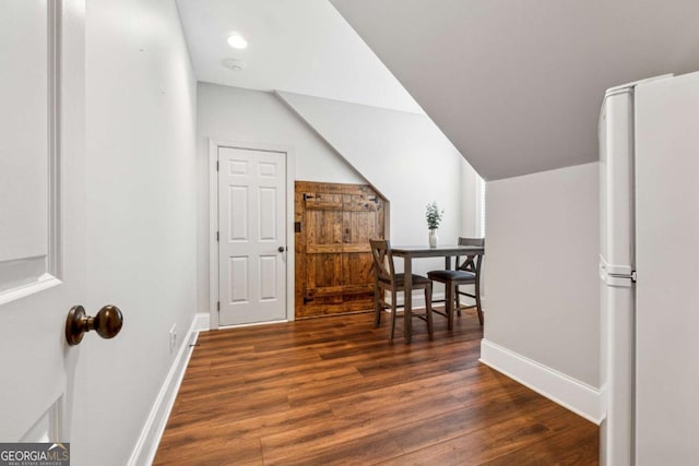 bonus room featuring dark hardwood / wood-style floors and lofted ceiling