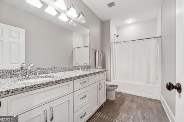 full bathroom featuring vanity, toilet, and shower / bath combination with curtain