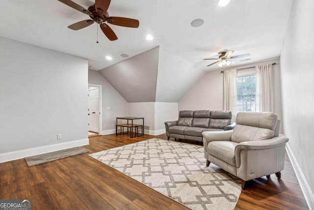 living room featuring vaulted ceiling, ceiling fan, and hardwood / wood-style floors