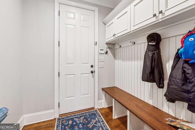 mudroom featuring dark hardwood / wood-style flooring and crown molding