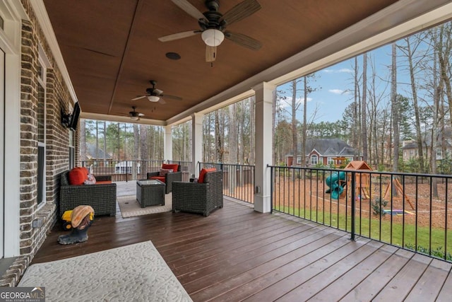 deck featuring an outdoor living space, ceiling fan, and a playground