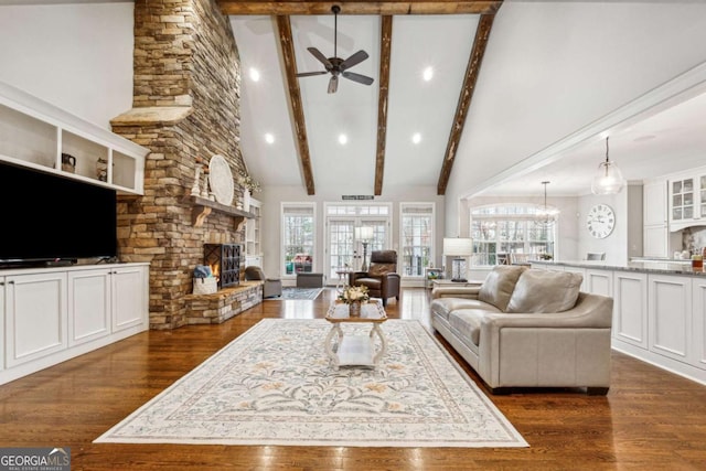 living room with a fireplace, beam ceiling, high vaulted ceiling, and dark hardwood / wood-style flooring