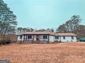 ranch-style house featuring a porch