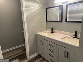 bathroom with hardwood / wood-style flooring and vanity