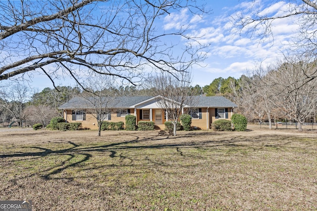 ranch-style house with a front yard