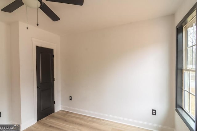 spare room featuring ceiling fan and light hardwood / wood-style flooring