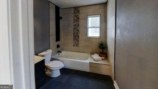 full bathroom with vanity, toilet, tiled shower / bath, and tile patterned flooring