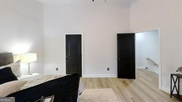 bedroom with light wood-type flooring