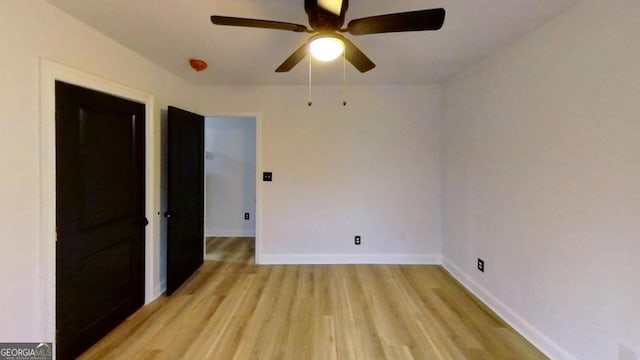 empty room with light hardwood / wood-style floors and ceiling fan