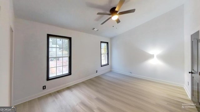 unfurnished room with ceiling fan and light hardwood / wood-style flooring