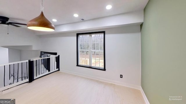 unfurnished room featuring ceiling fan